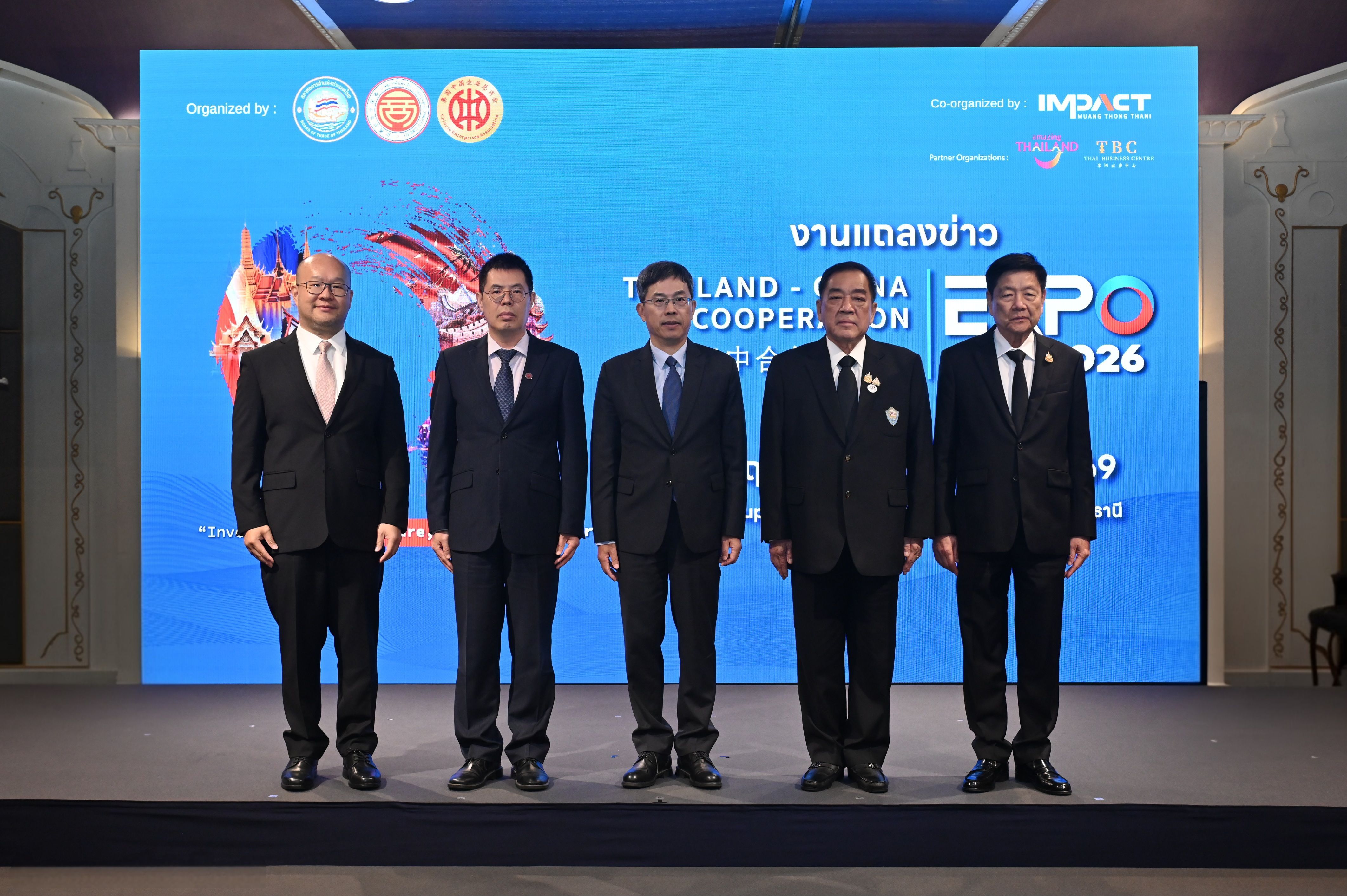 Five men in suits stand on stage before a screen with "Thailand-India Cooperation Expo 2026".