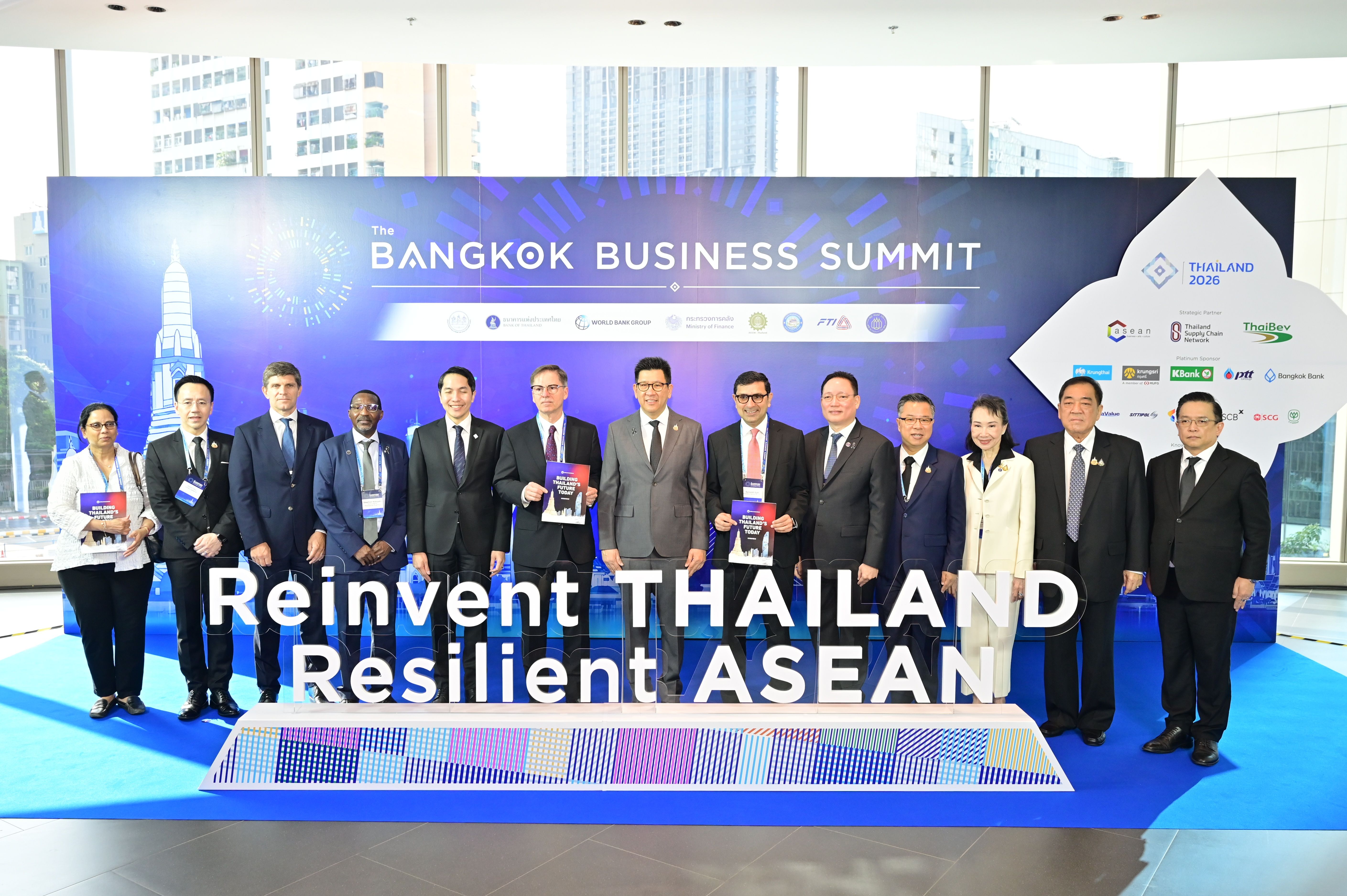 Group of business leaders at the Bangkok Business Summit displaying 'Reinvent THAILAND Resilient ASEAN'.