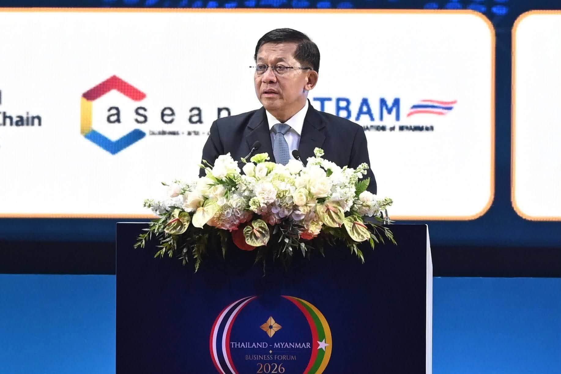 Man in suit speaks at a podium with ASEAN and other logos in the background.