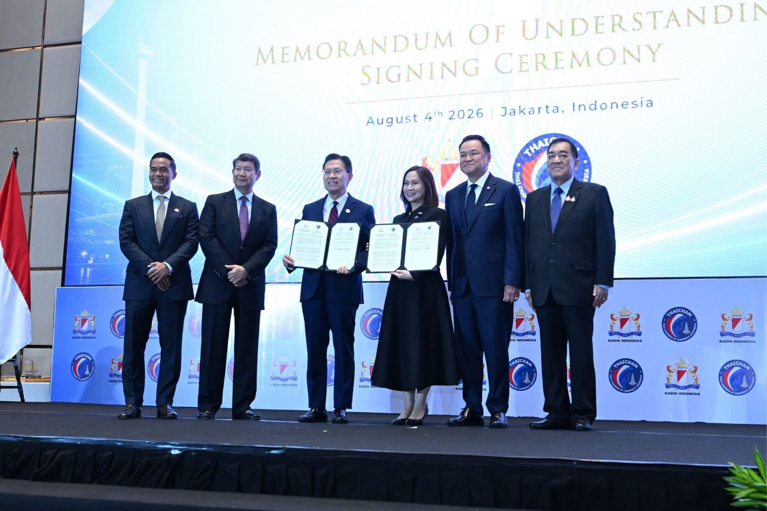 Six professionals on stage after signing a Memorandum of Understanding in Jakarta, Indonesia.