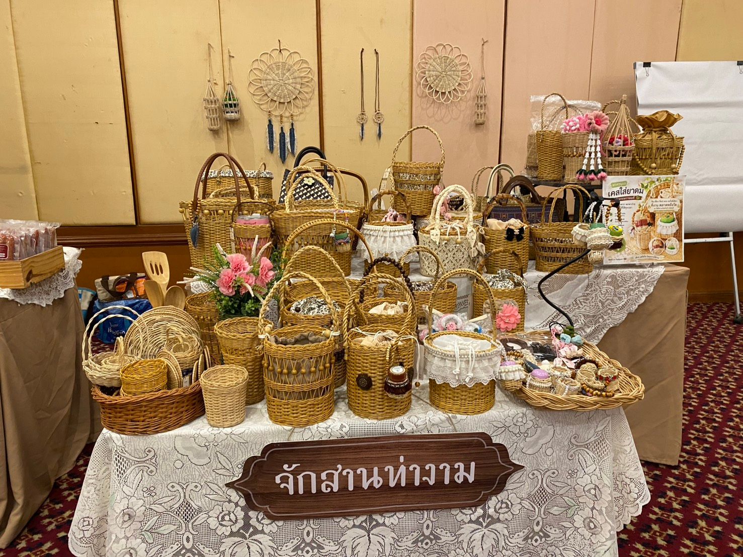 An array of handcrafted woven baskets and decorative items displayed on a table.
